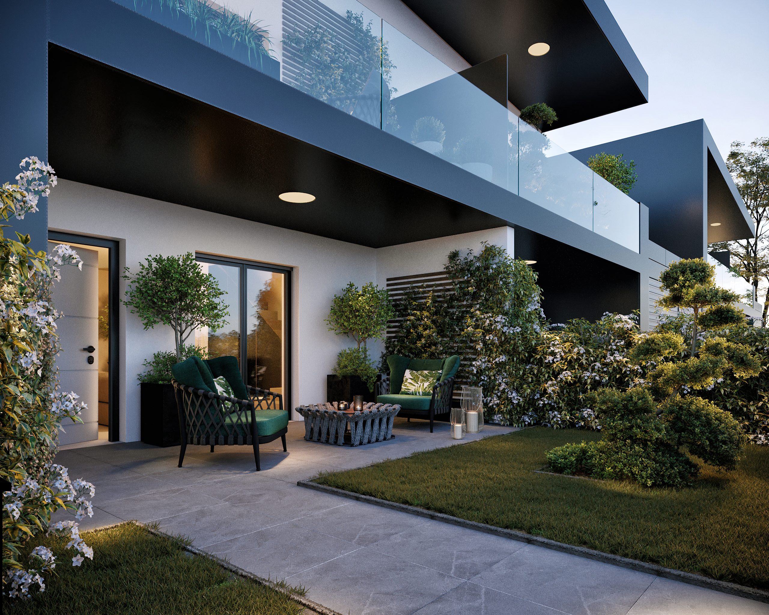 Borgo dei Poeti - Vista frontale del giardino con la porta di ingresso alla casa e ampia finestra. È presente inoltre una piccola zona relax con due poltrone e un piccolo tavolino
